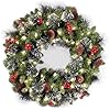 National Tree Company 24 in Pre-Lit Crestwood Spruce Artificial Christmas Wreath, Christmas Decoration with Glitter, Pinecones, Red Berries, 50 Clear LED Lights, 160 Tips, Timer, Green
